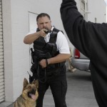 Officer Aiming Gun At Thief
